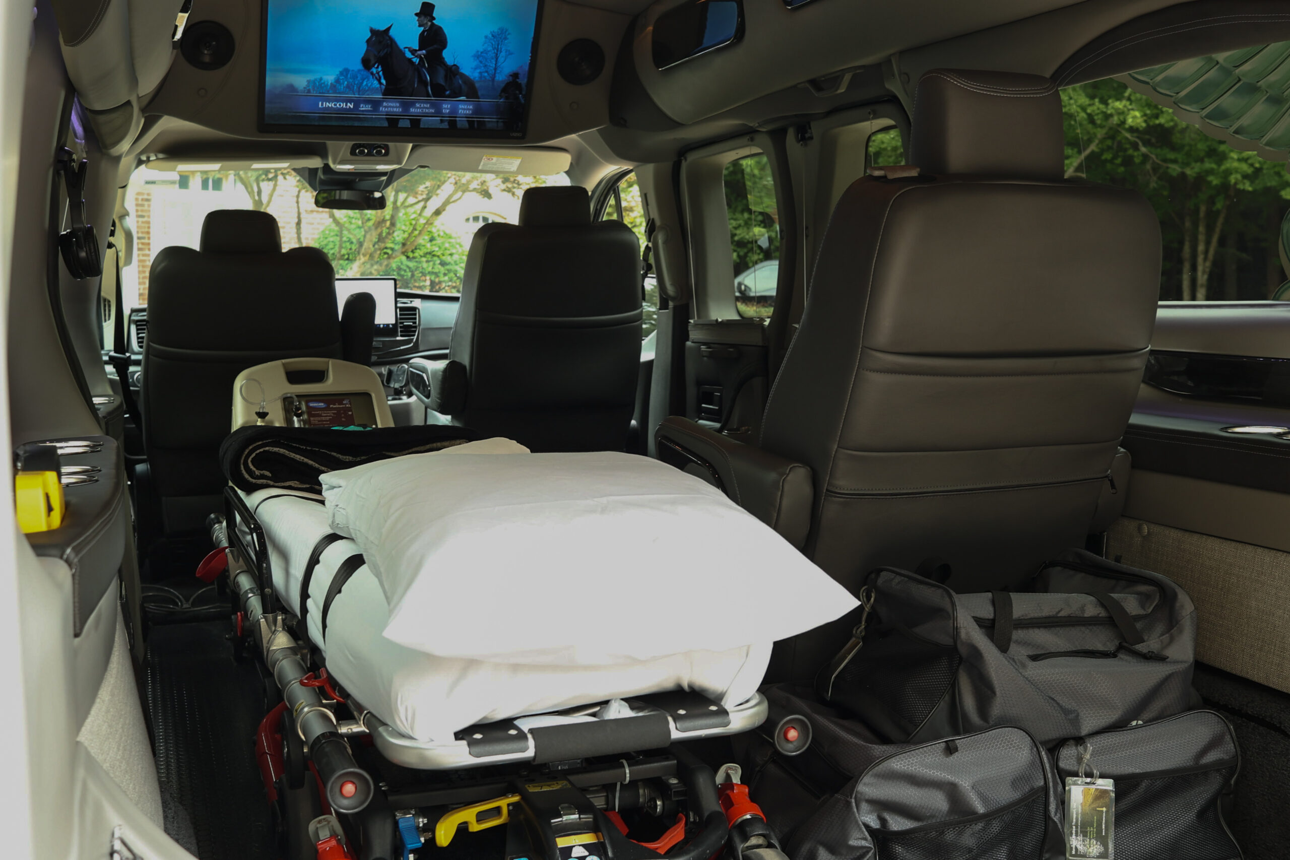 Van with safety features for long-distance medical transport by Managed Medical Transport, Inc.